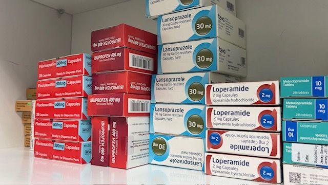 Boxes of medication in cupboard