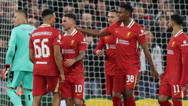 Liverpool players celebrate a goal