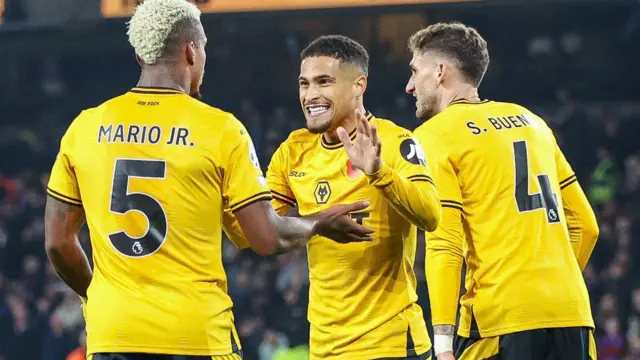 Joao Gomes celebrates his goal against Crystal Palace with Mario Lemina and Santi Bueno. 