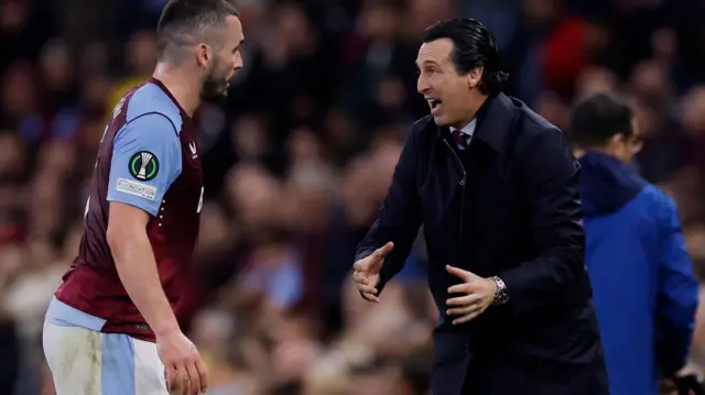 John McGinn and Unai Emery in discussion