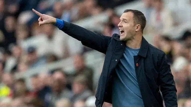 Birmingham City boss Chris Davies points at his players while shouting instructions from the touchline during a game