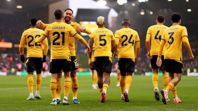 Wolves players celebrate a goal