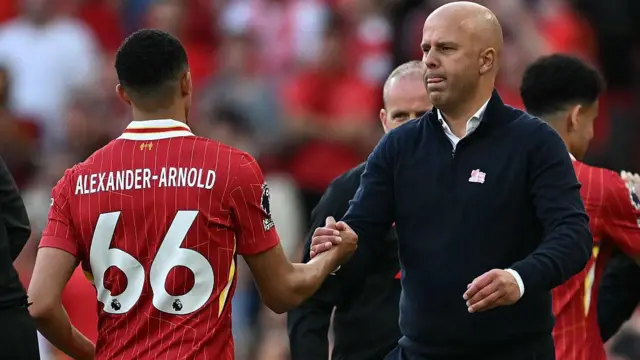 Alexander-Arnold and Slot interact during the game against Tottenham