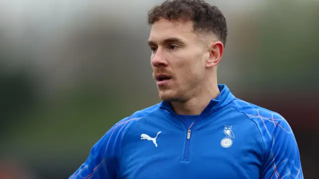 Kieron Morris waring up before an Oldham match