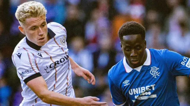 Dundee's Joe Westley and Rangers' Djeidi Gassama 