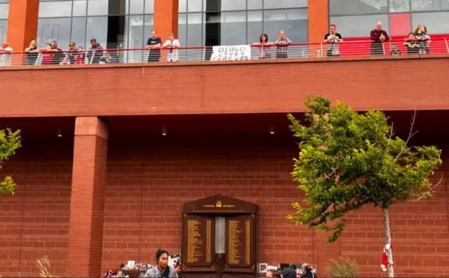 A small placard sits above the Hillsborough Memorial and simply reads 'Diogo Lives Forever'