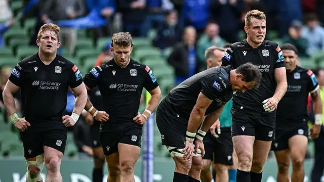 Glasgow Warriors players dejected after conceding a sixth try during the United Rugby Championship semi-final match between Leinster and Glasgow Warriors at the Aviva Stadium in Dublin