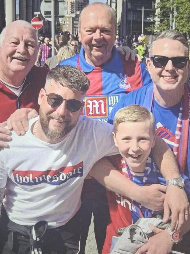 A group of Crystal Palace supporters in their club shirts