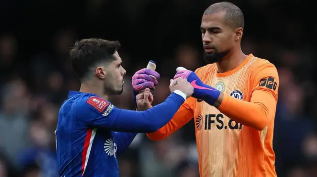 Pedro Neto and Robert Sanchez bump fists