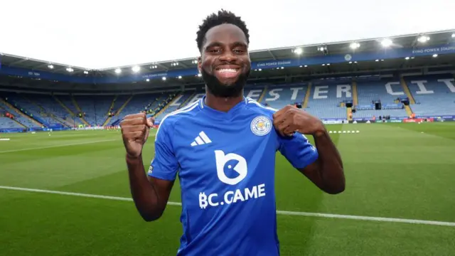 Odsonne Edouard poses in his new Leicester City kit at the King Power Stadium