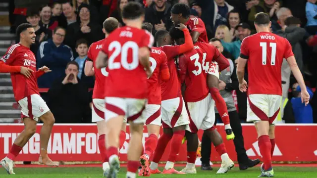 Ola Aina of Nottingham Forest celebrates with his teammates after scoring a goal to make it 3-0 during the Premier League match between Nottingham Forest and West Ham United at the City Ground