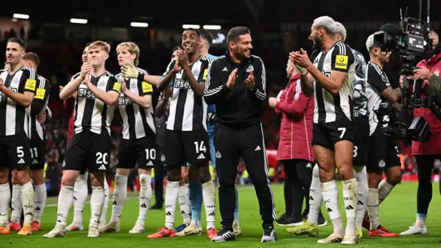 Jason Tindall, Assistant Manager of Newcastle United, celebrates with Joelinton of Newcastle United at the end of the Premier League match between Manchester United FC and Newcastle United FC at Old Trafford on December 30, 2024