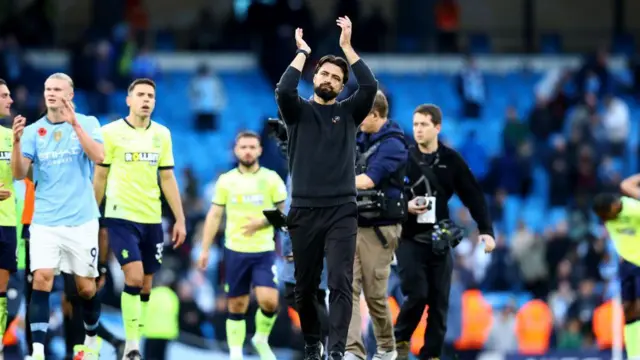 Southampton manager Russell Martin acknowledges the travelling fans after losing at Manchester City