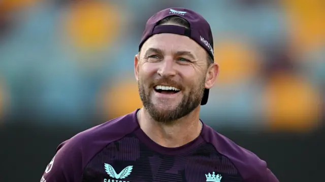England coach Brendon McCullum smiles during a training session