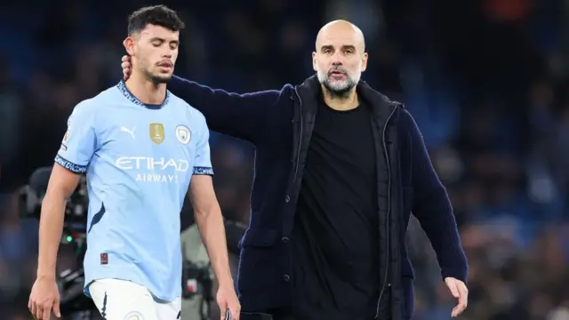 Guardiola, manager of Manchester City, consoles Matheus Nunes