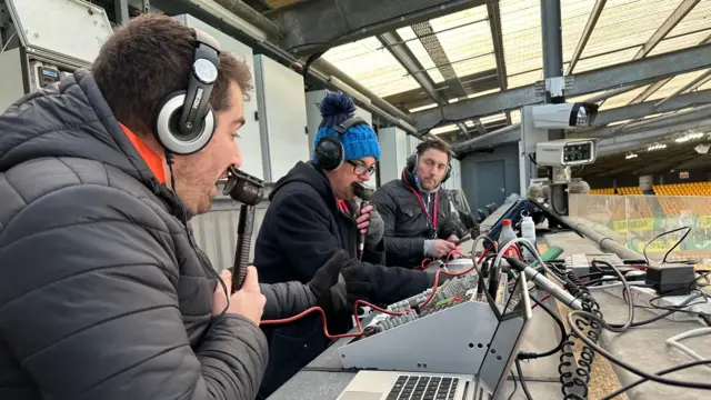 Phil Daley, Chris Goreham and Che Wilson on the Norwich City gantry