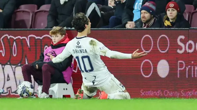 Yan Dhanda celebrates scoring a free-kick against Hearts