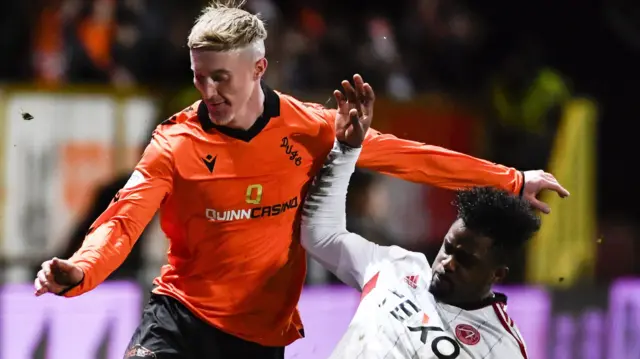 Dundee United's Craig Sibbald and Aberdeen's Luis Lopes