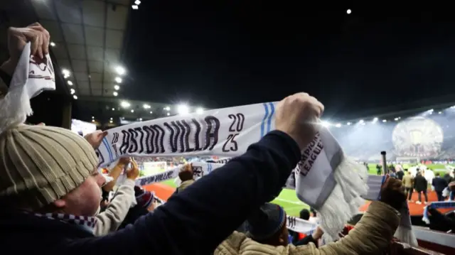 Aston Vila fans hold up scarves