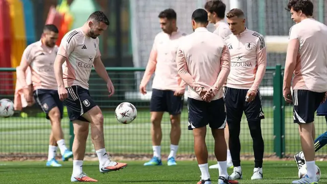 John McGinn controls the ball during a training session