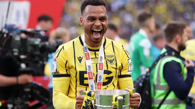 Josh Murphy celebrates promotion with Oxford United