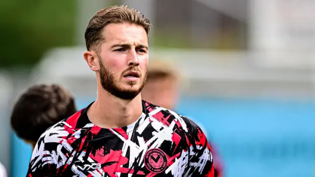 Matt Baker warms up for a Newport County match