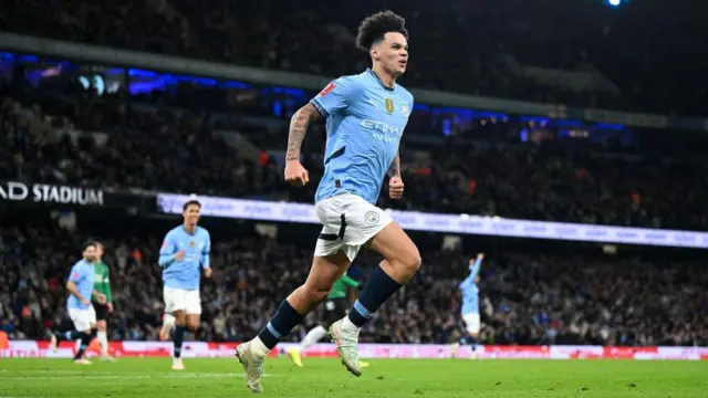 Nico O'Reilly celebrates scoring a goal for Manchester City against Plymouth Argyle