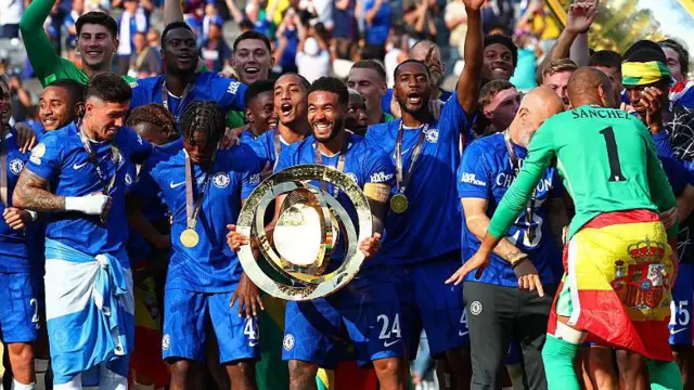 Reece James holds Club World Cup trophy with Chelsea players