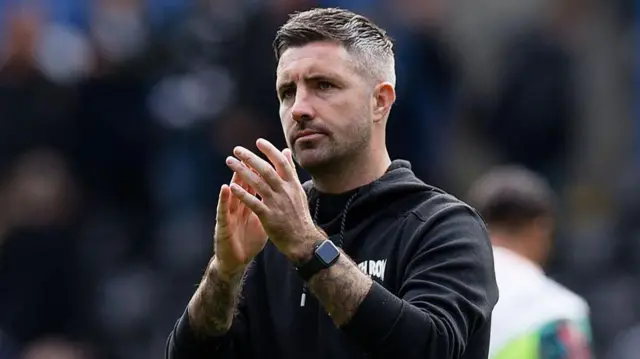 Alan Sheehan applauds Swansea fans after their draw with Millwall 
