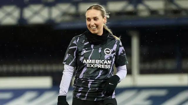 Bex Rayner smiles while warming up
