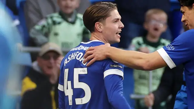 Cian Ashford getting a pat on the back from Cardiff City teammate Yousef Salech.