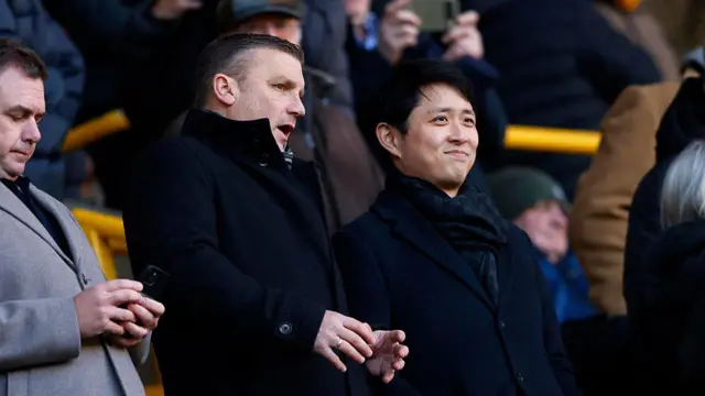Technical director Matt Jackson of Wolverhampton Wanderers (L) chats to chairman Nathan Shi 