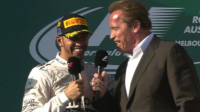 Lewis Hamilton shares a laugh with Arnold Schwarzenegger