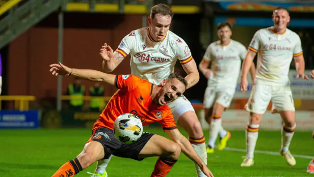 Dundee United's Kristijan Trapanovski and Motherwell's Kofi Balmer in action during a William Hill Premiership match between Dundee United and Motherwell at the CalForth Construction Arena at Tannadice Park