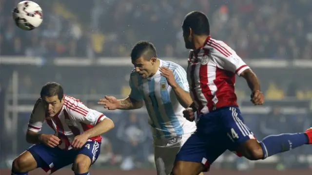 Sergio Aguero heads in Argentina's fifth against Paraguay