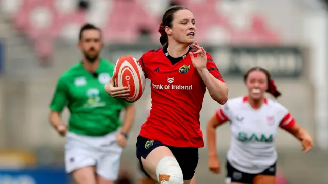 Alana McInerney runs clear for a try