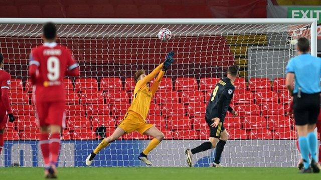 Liverpool goalkeeper Caoimhin Kelleher keeps out a header from Ajax's Klaas-Jan Huntelaar
