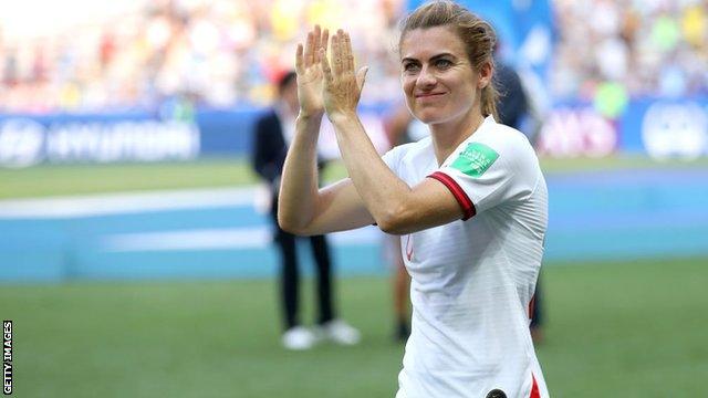 Karen Carney celebrates playing in her final match for England
