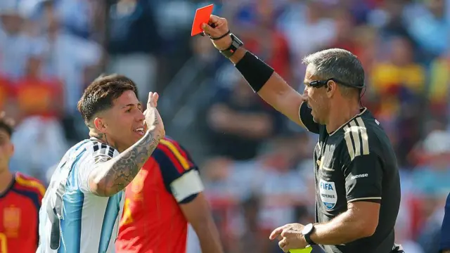 Enzo Fernandez of Argentina is shown a red card