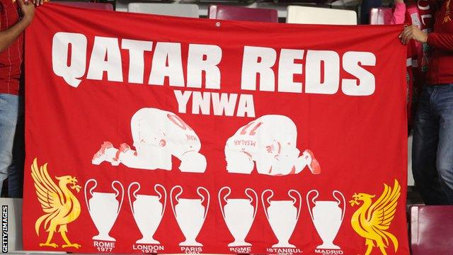 Liverpool fans with a banner in Qatar