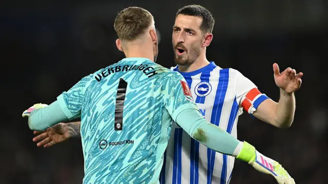Lewis Dunk of Brighton interacts with teammate Bart Verbruggen