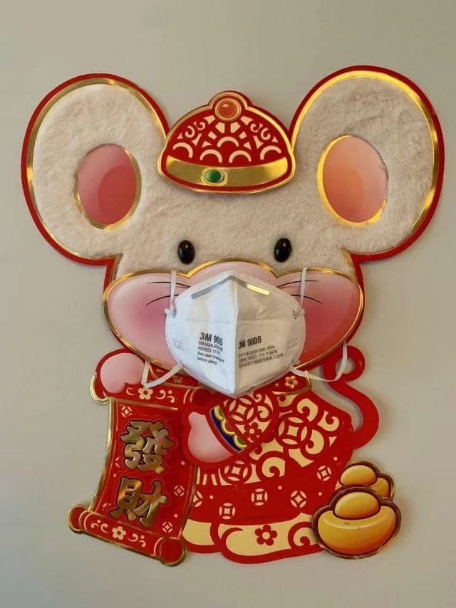 An image of a spring festival decorative sticker with a mask-wearing rat.