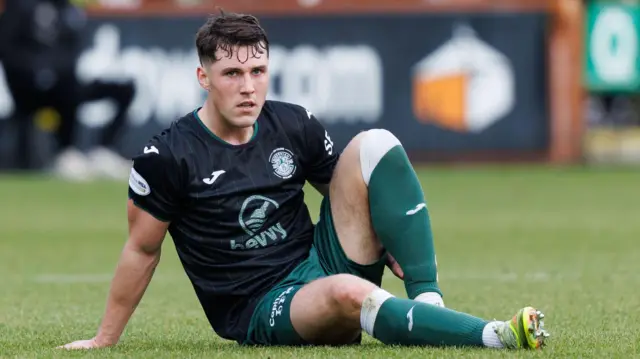 Josh Mulligan goes down injured during a Scottish Cup match between Hibernian and Dunfermline