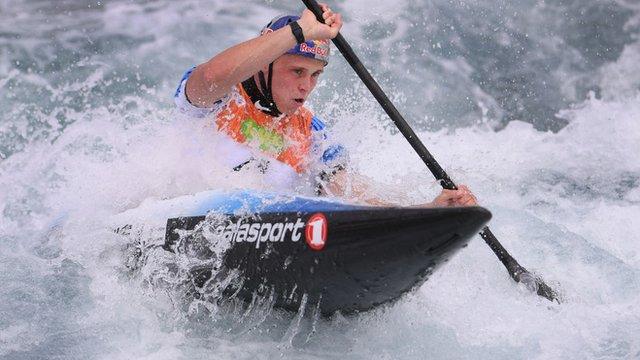 Joe Clarke paddling in his canoe