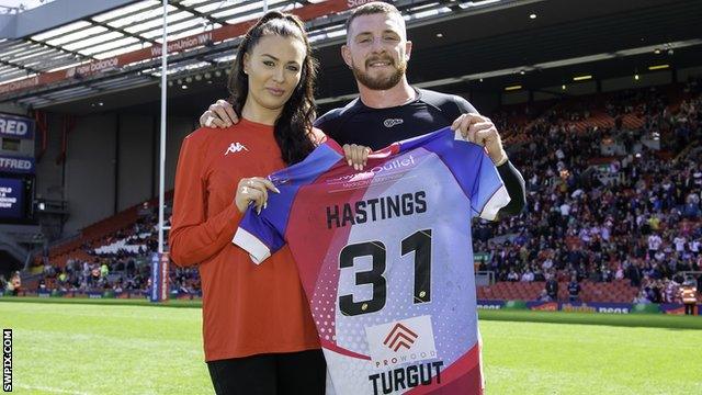 Jansin Turgut's partner Stephanie Gaunt was presented with a shirt by Salford half-back Jackson Hastings at Magic Weekend at Anfield