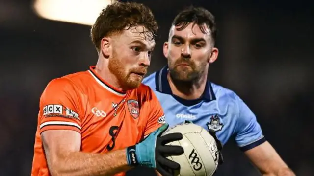 Jason Duffy is challenged by Dublin's Sean MacMahon in Saturday night's game