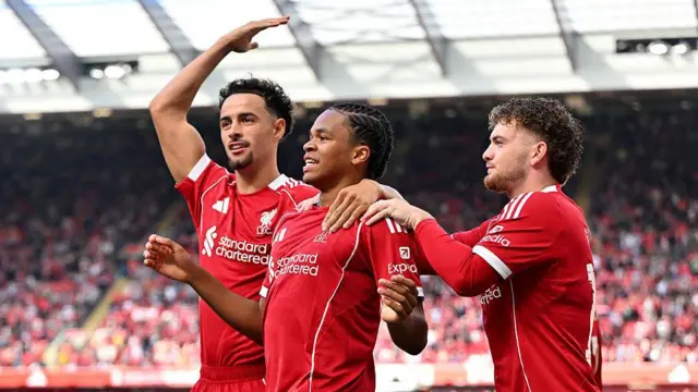 Curtis Jones, Rio Ngumoha and Harvey Elliott celerbate a goal for Liverpool