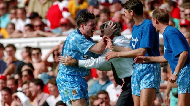 Micky Quinn celebrates a goal for Coventry