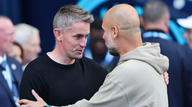 Kieran McKenna and Pep Guardiola embrace