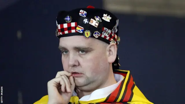 A dejected Scotland fan